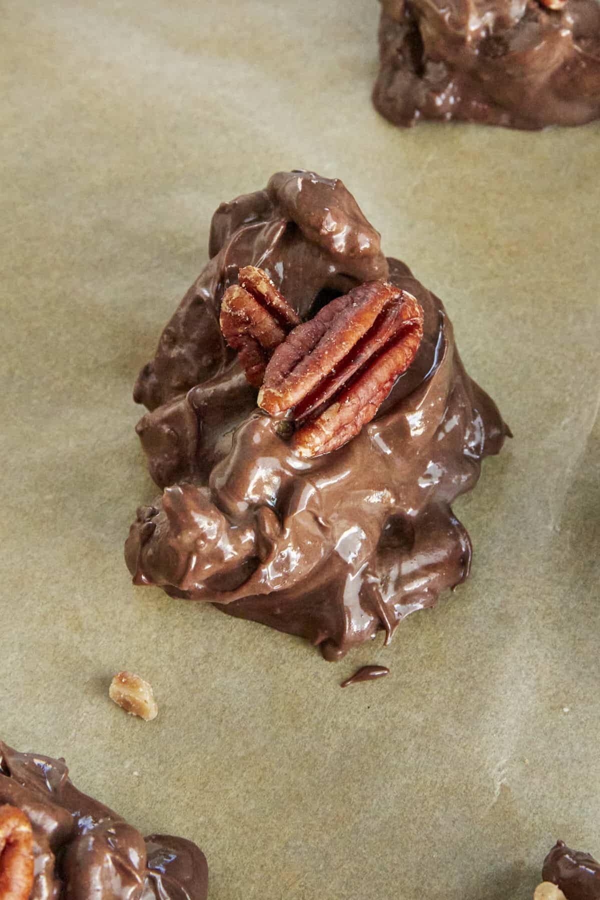 A caramel pecan cluster on a baking sheet. 