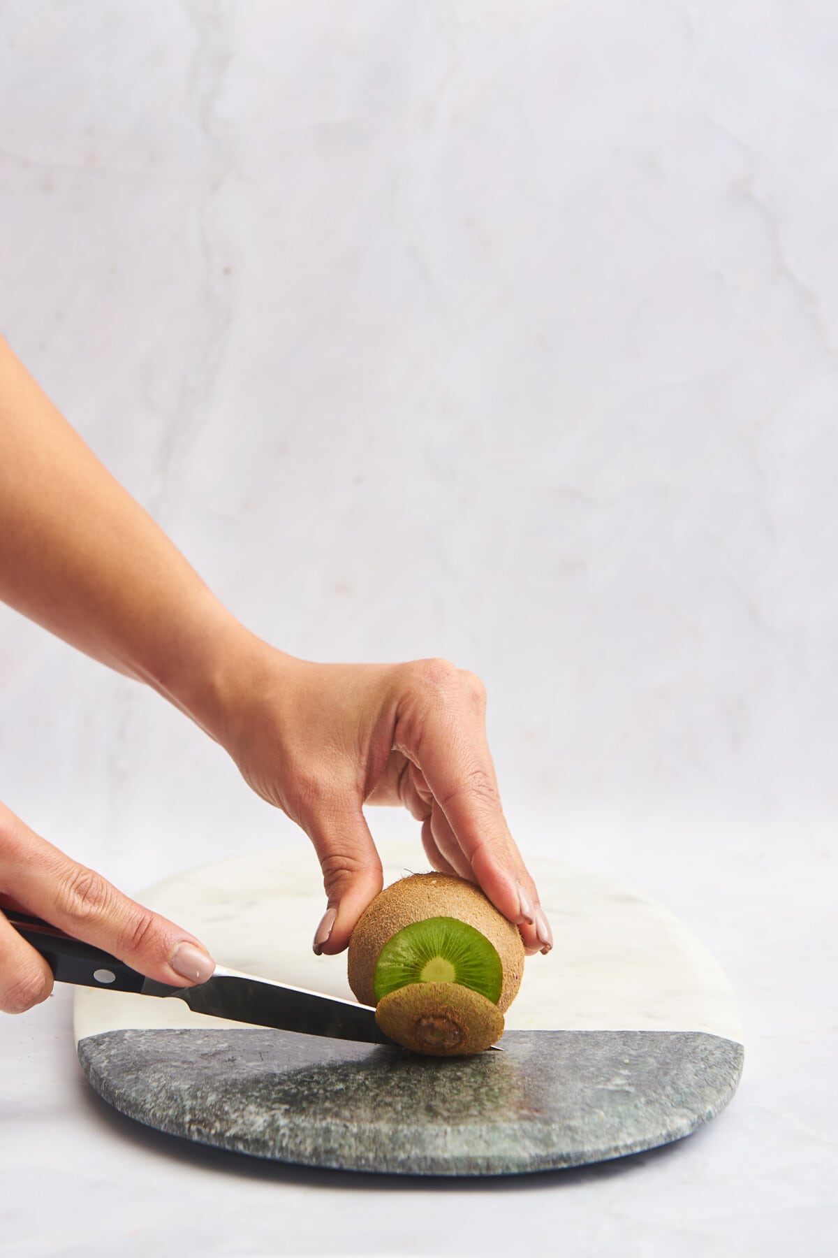 The end of a kiwi being trimmed. 