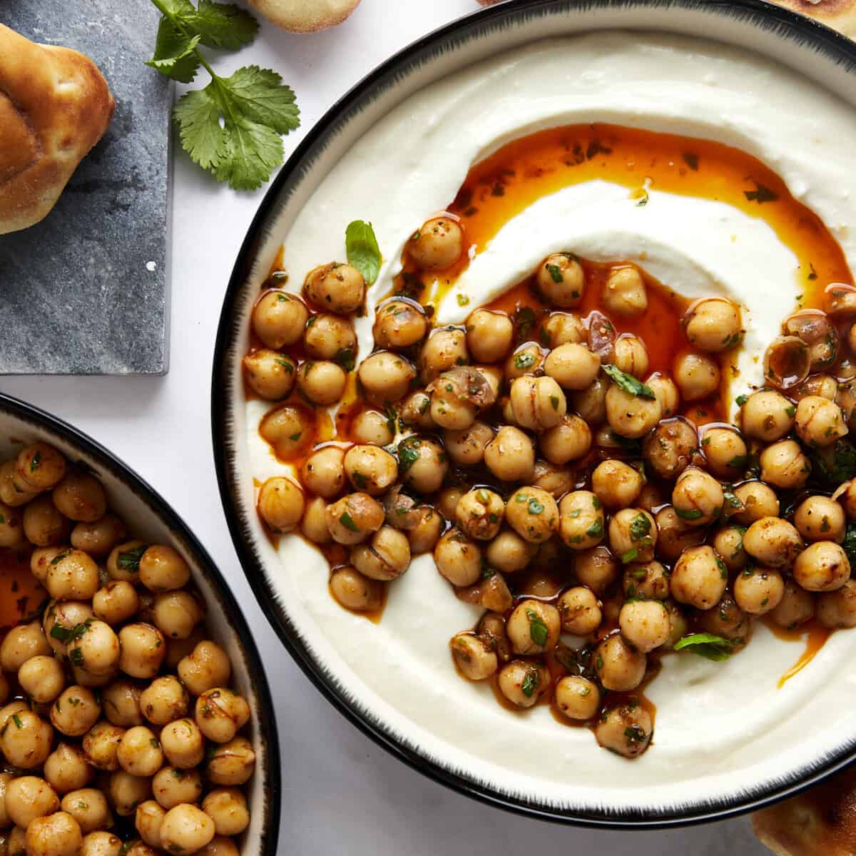 A bowl of whipped feta topped with marinated chickpeas.