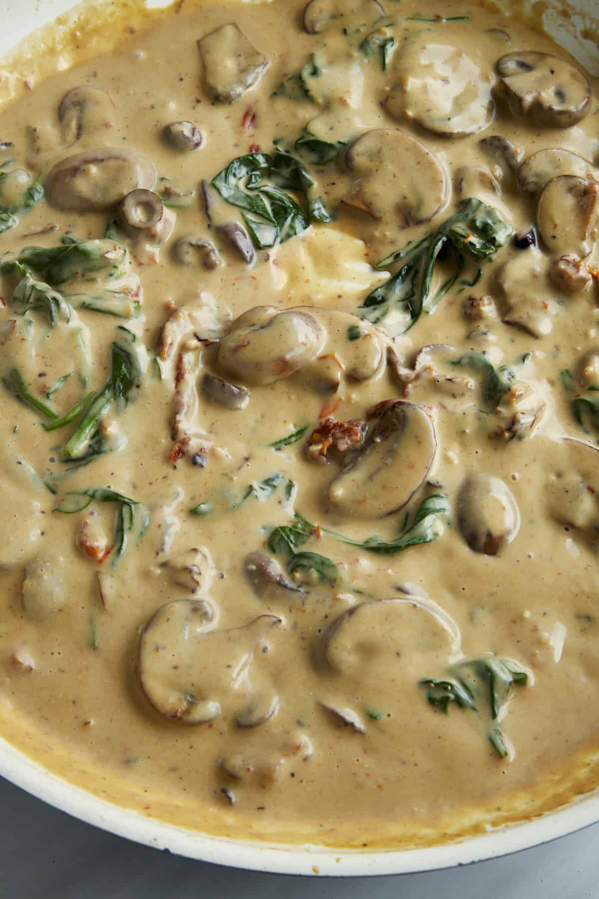 Mushrooms, sun-dried tomatoes, and spinach in a creamy sauce. 