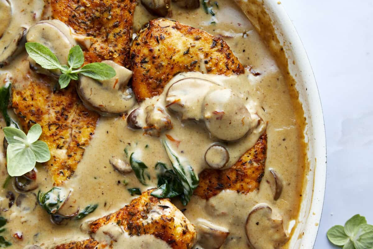 Creamy mushroom chicken in a skillet.