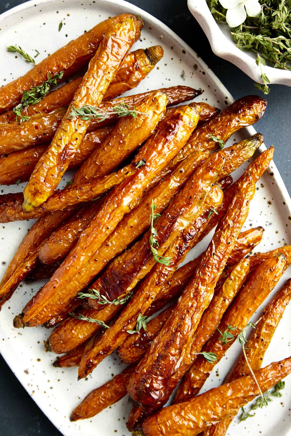 A platter of baked carrots. 