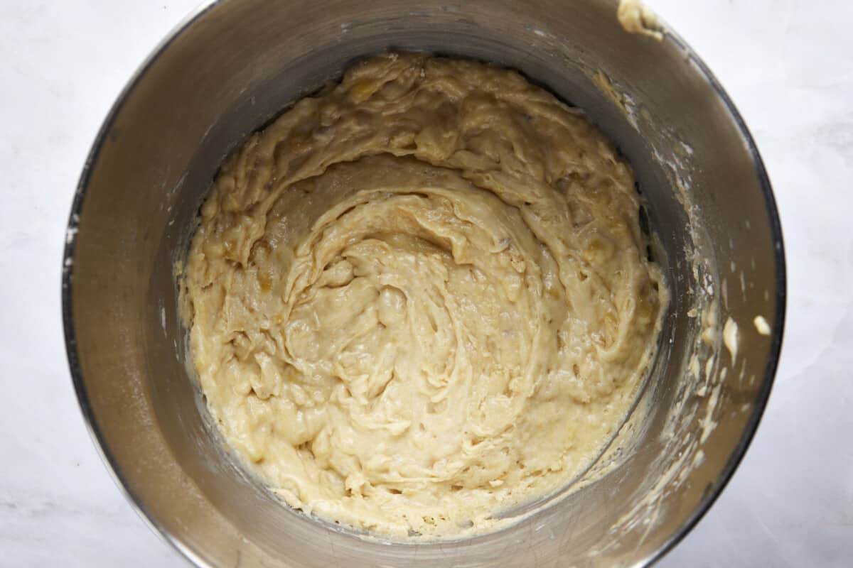 Banana bread batter in a large mixing bowl. 