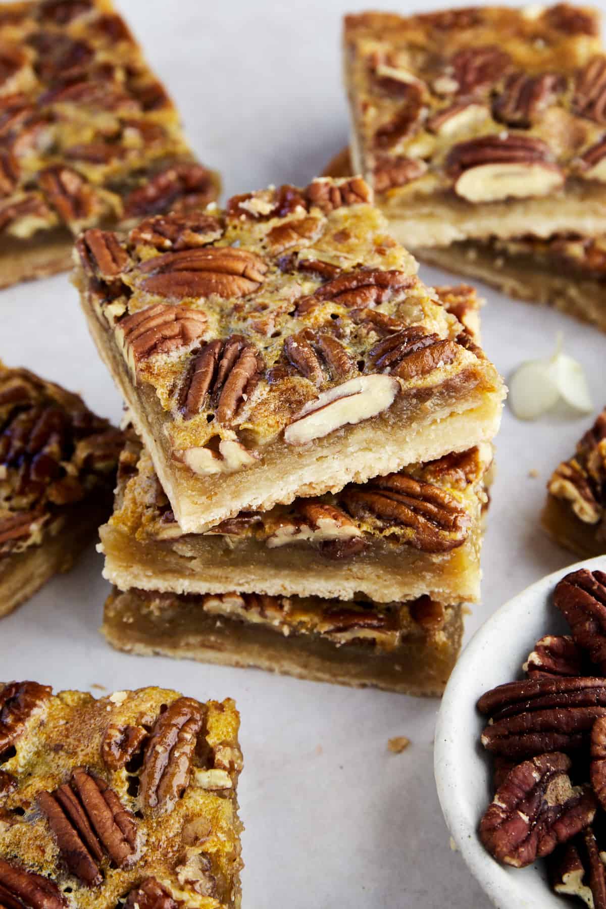 Easy pecan pie bars stacked on top of each other.