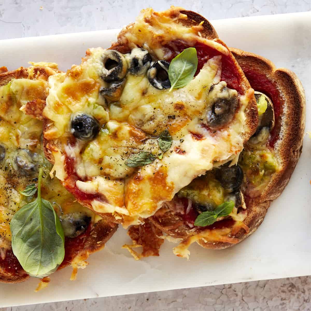 Slices of sheet pan pizza on a plate.