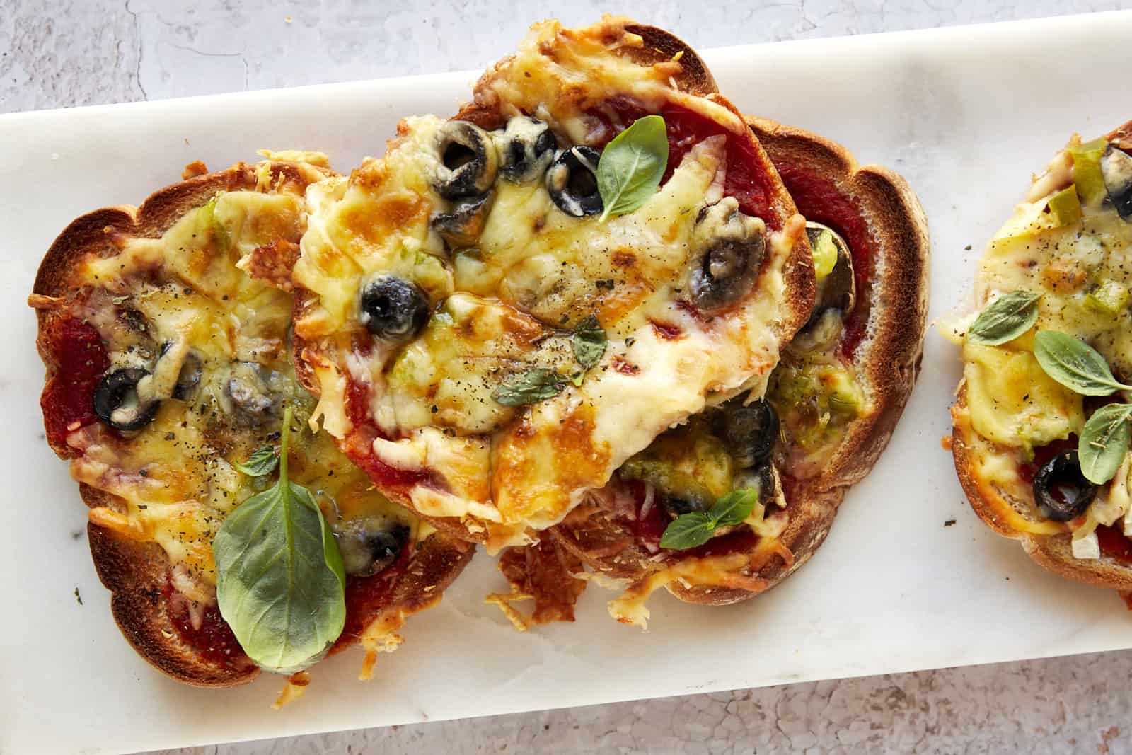 Slices of sheet pan pizza on a plate.