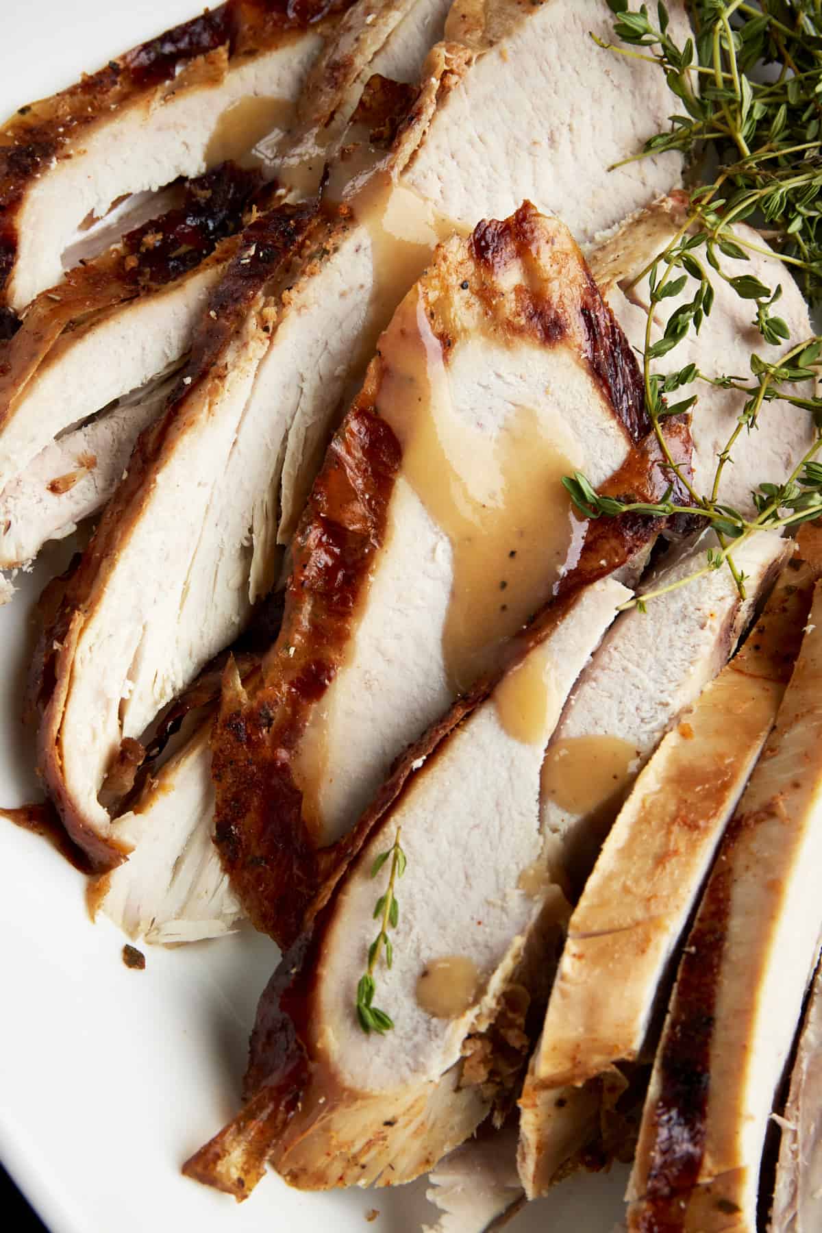 Sliced turkey drizzled with gravy. 