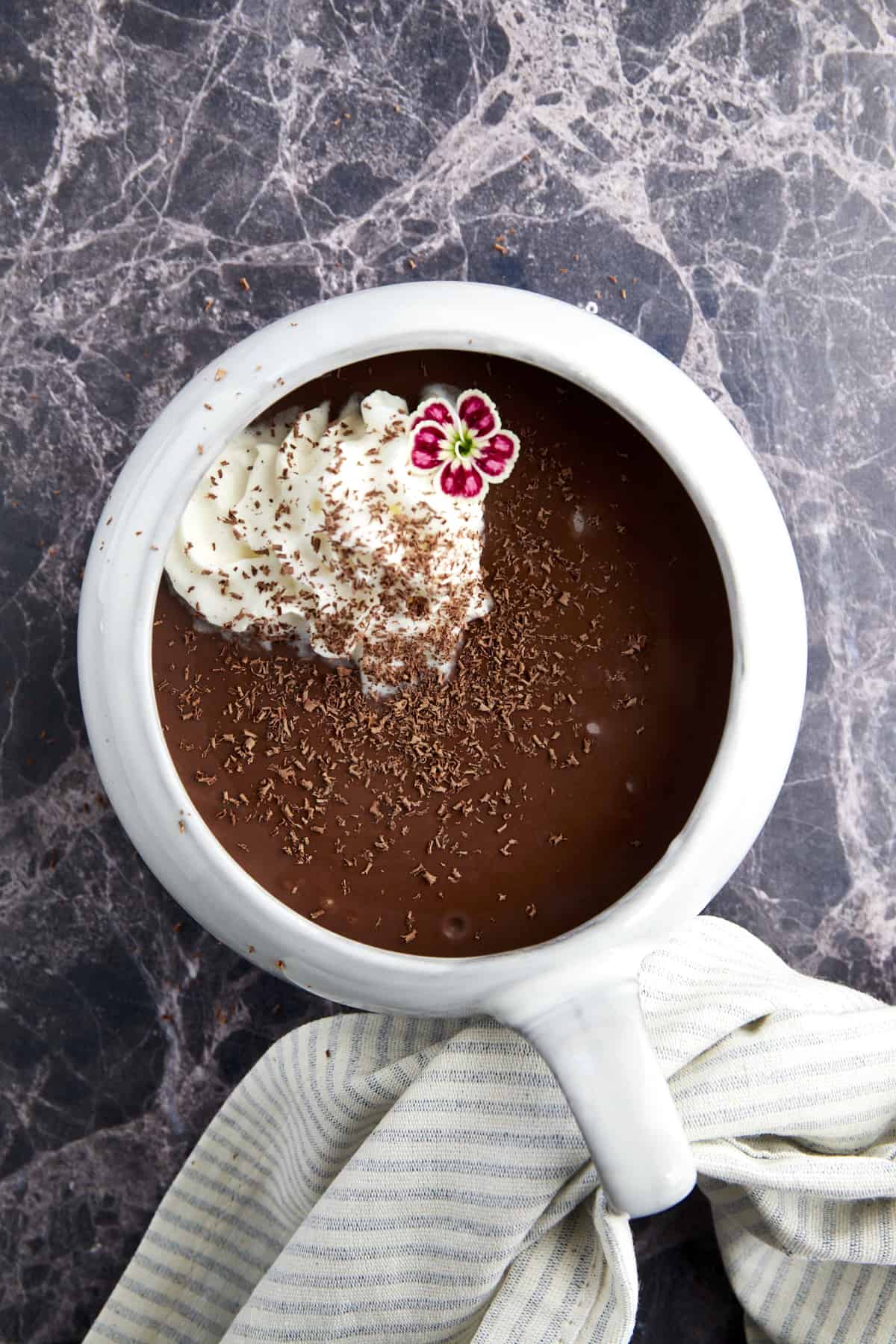 Bone broth hot chocolate topped with whipped cream and chocolate shavings. 