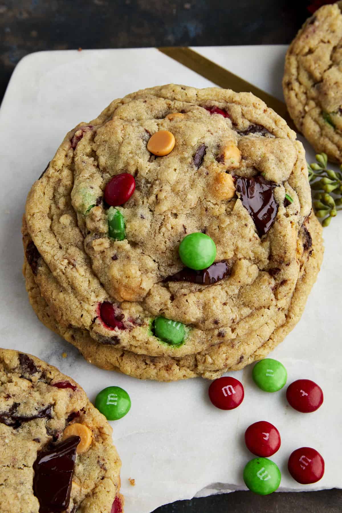 Two Christmas monster cookies on top of each other. 