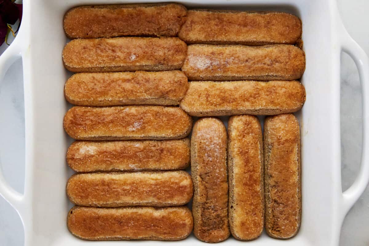 Coffee soaked ladyfingers in the bottom of a baking dish. 