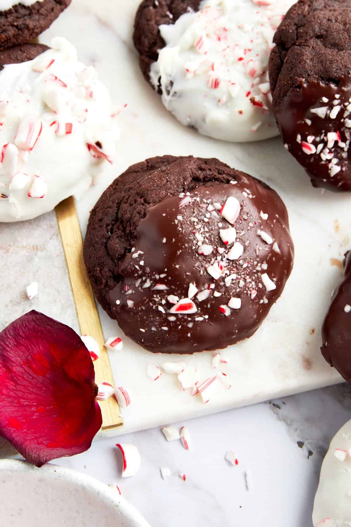 Dipped chocolate peppermint cookies topped with candy canes. 