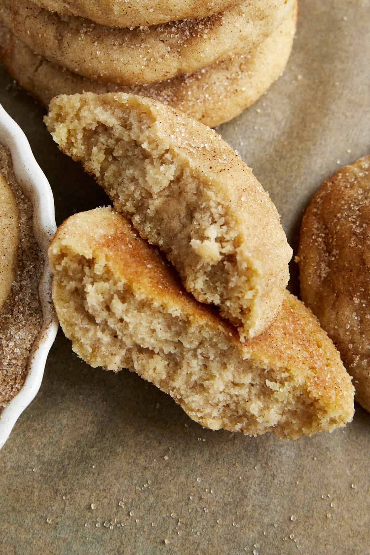 A snickerdoodle cookie split in half.