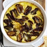 Eggs and dates in a round baking dish.