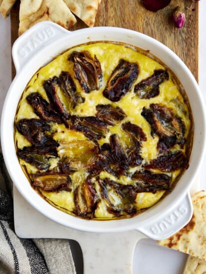 Eggs and dates in a round baking dish.