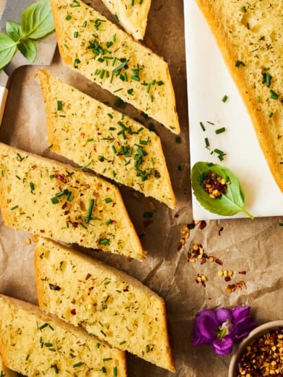 Slices of herbed garlic bread.