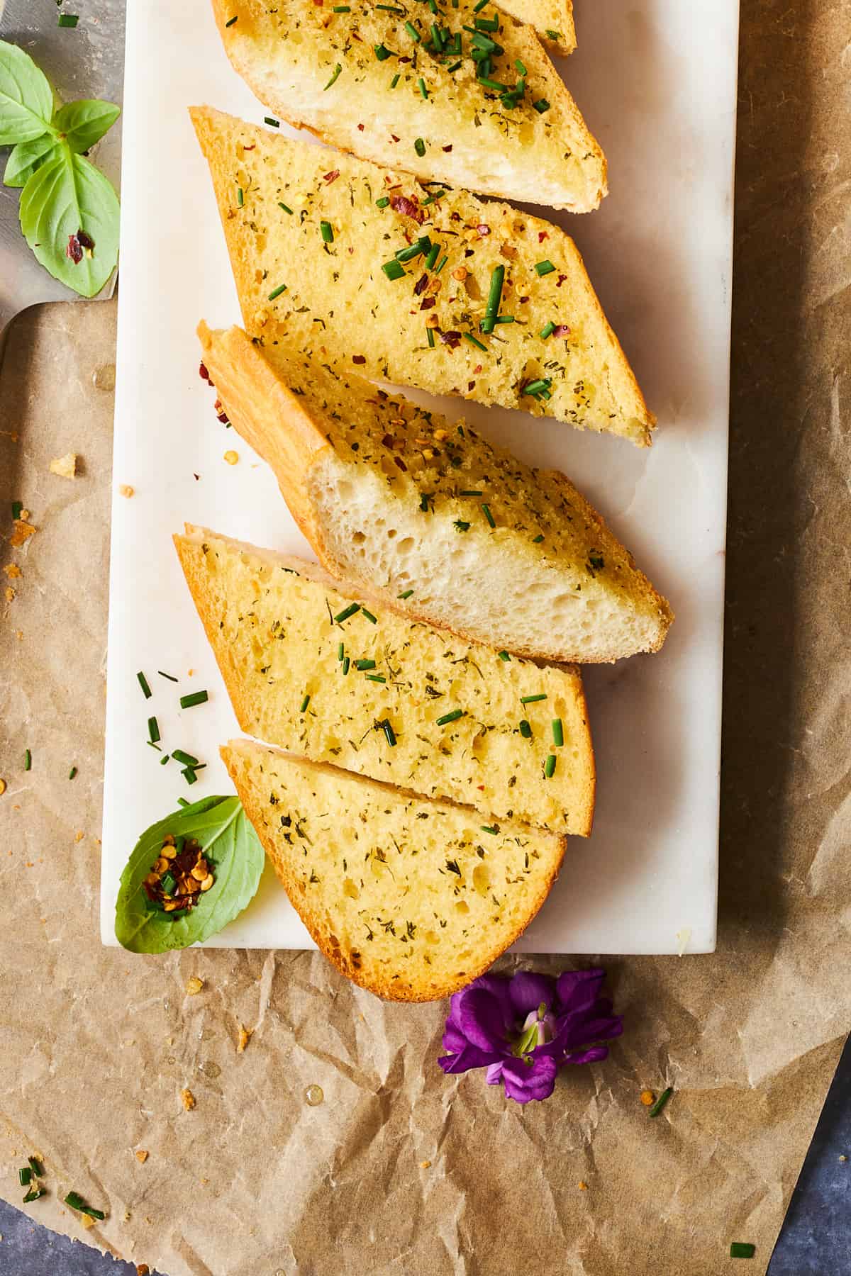 Garlic bread slices on a platter. 