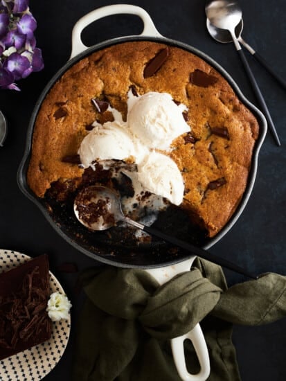 Skillet chocolate chip cookie recipe topped with vanilla ice cream.