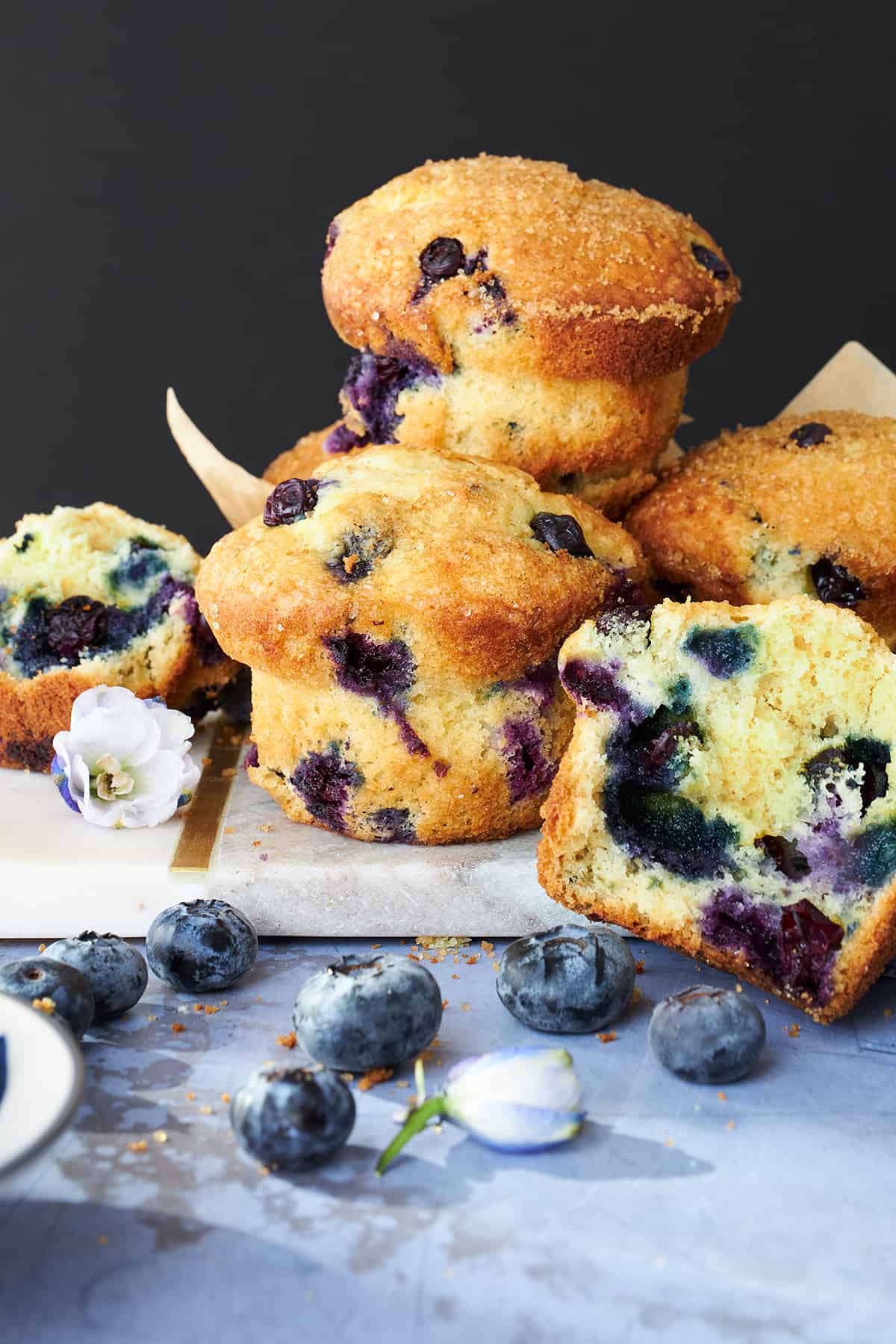 Starbucks blueberry muffins with one split in half. 