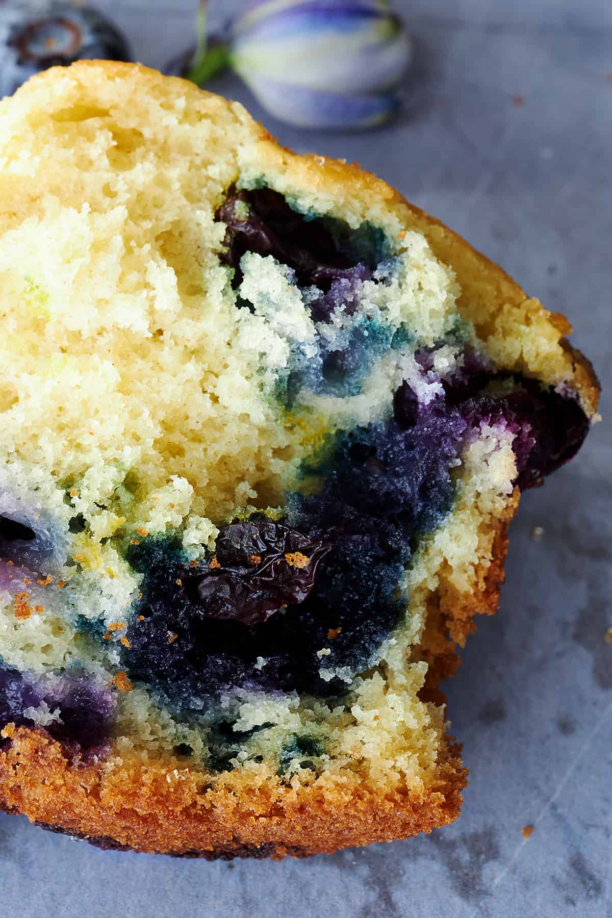 Half a Starbucks blueberry muffin, showing the soft fluffy center.