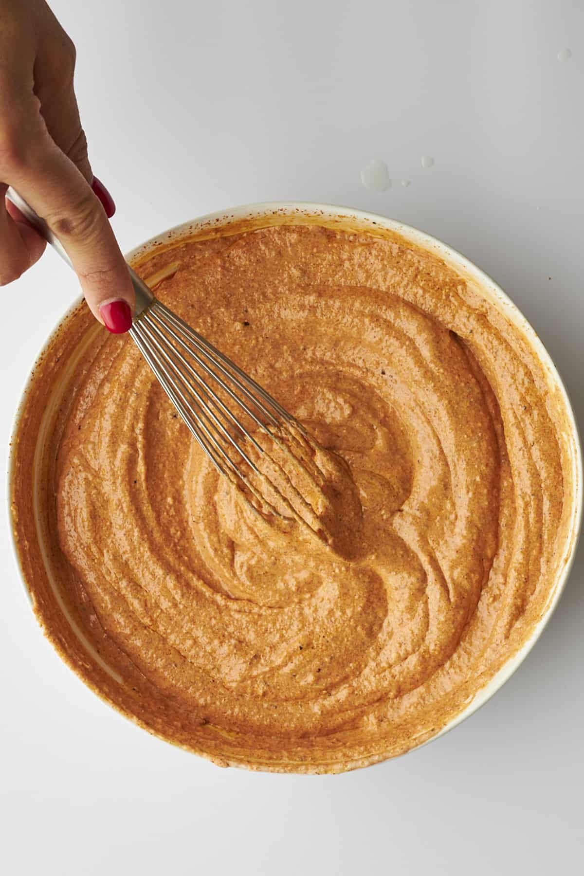 Chicken tikka marinade being whisked. 