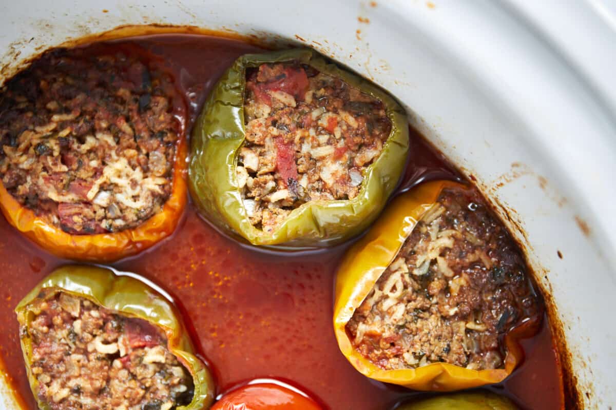 Cooked Mediterranean stuffed peppers in a slow cooker.