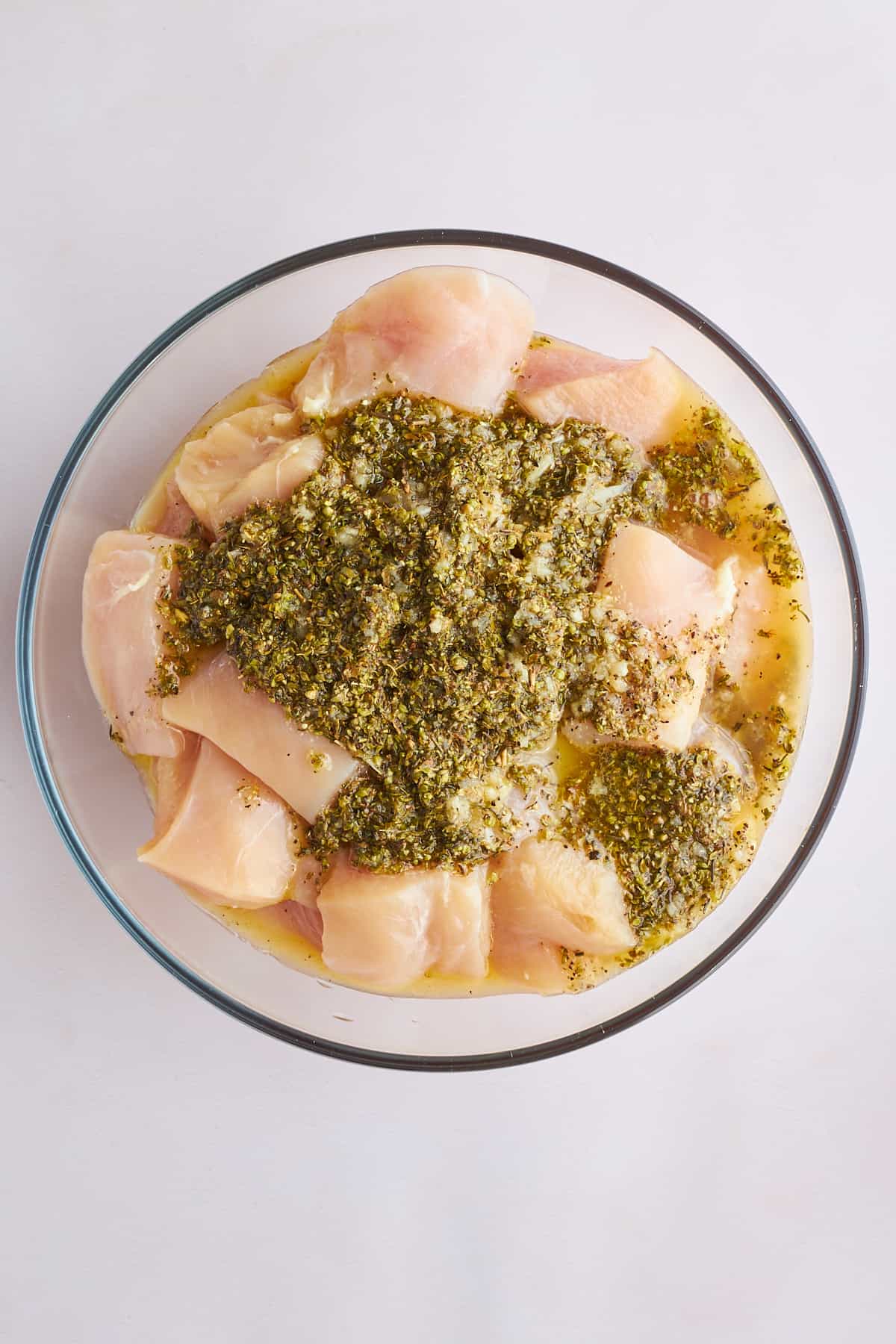 Raw chicken pieces marinading in souvlaki marinade. 