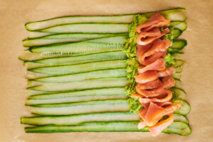 Avocado and salmon layered over cucumber strips.