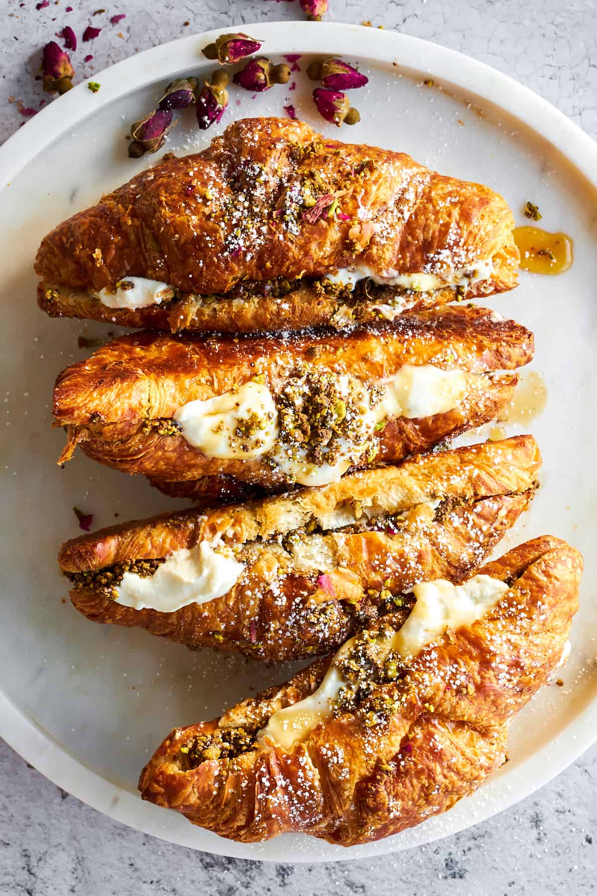 Chocolate Pistachio Croissants with Ricotta on a plate. 