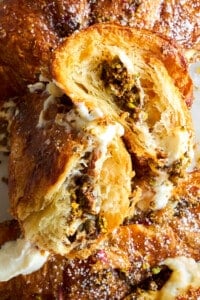 Chocolate pistachio croissants with ricotta topped with honey and pistachios.