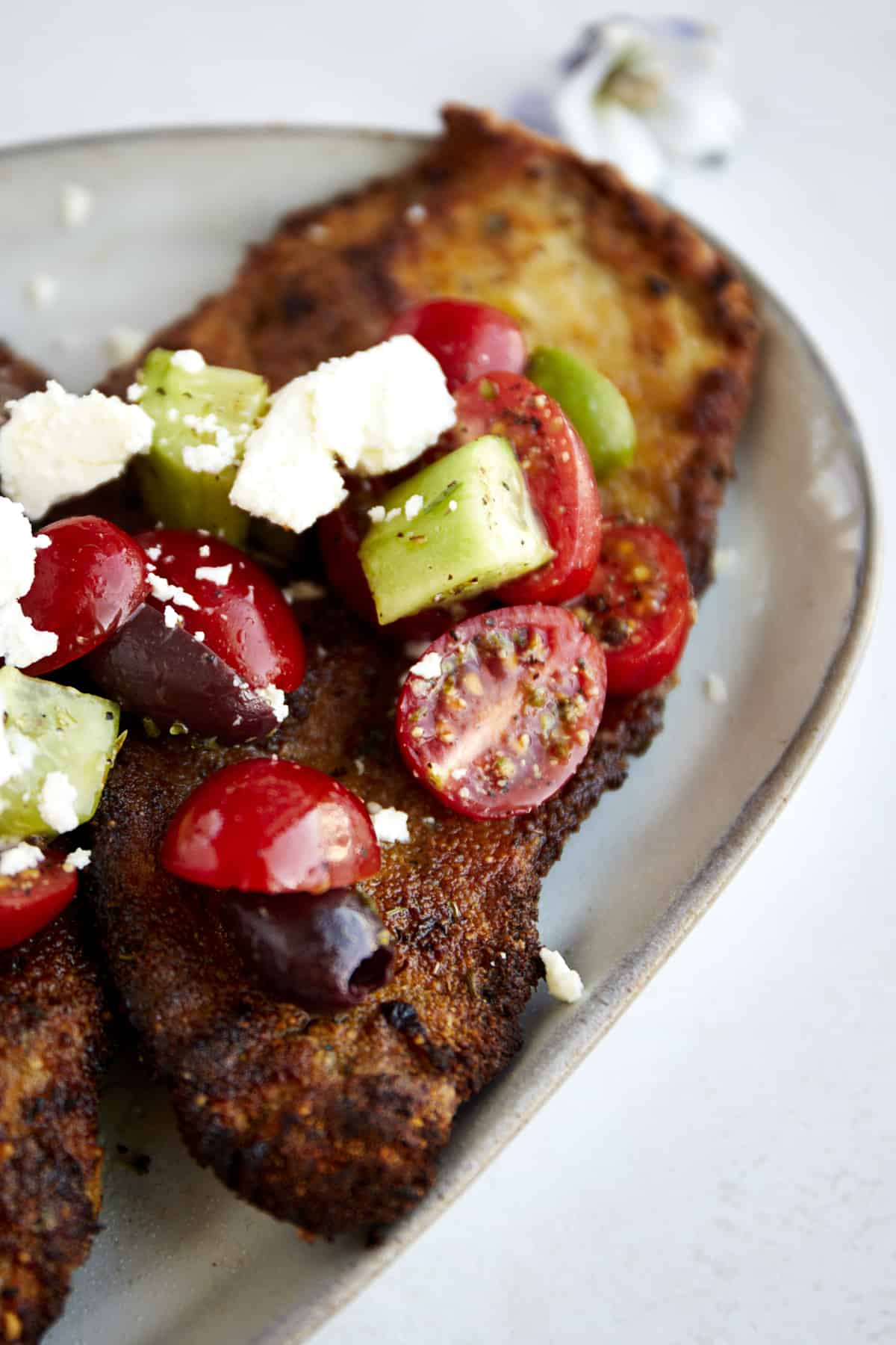 Chicken Milanese with Mediterranean Salad.