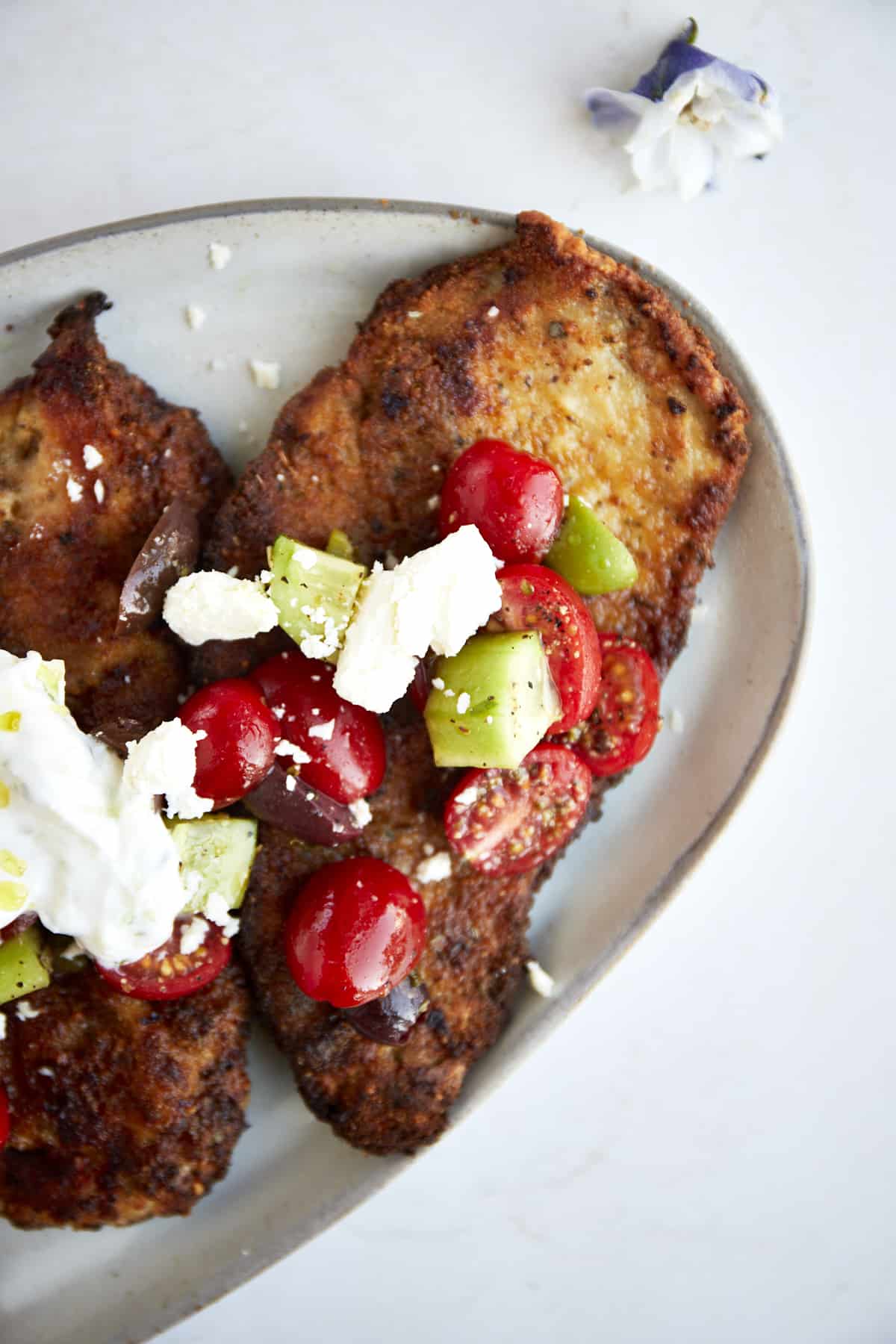 Chicken Milanese with a Mediterranean salad.