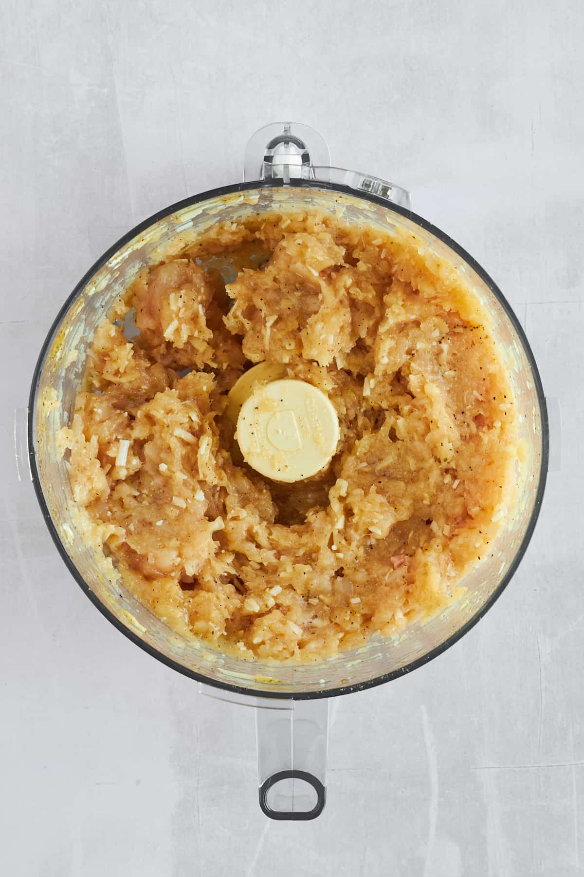 Raw blended chicken crust in a food processor. 