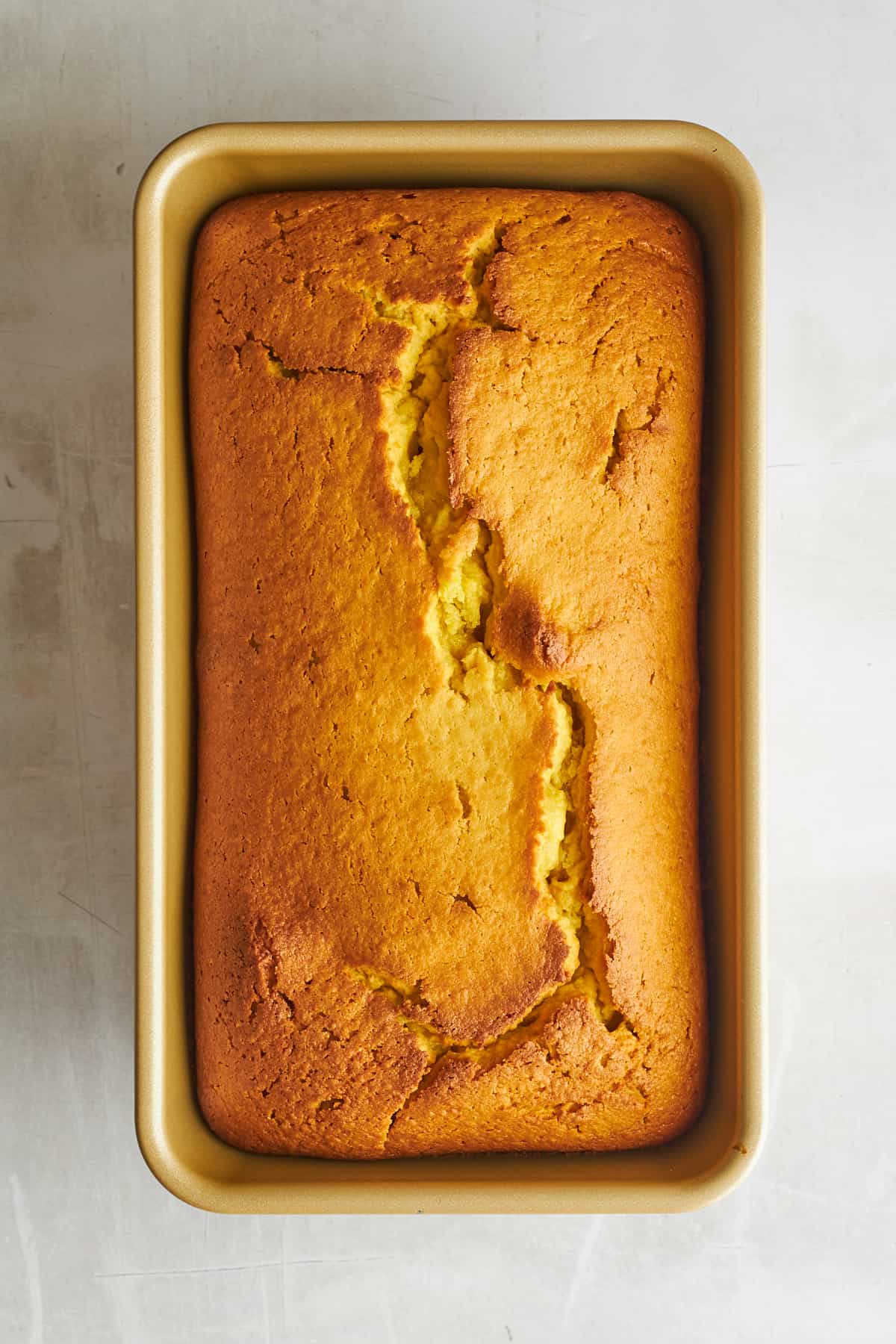 Baked orange blender cake in a loaf pan. 