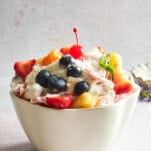 A bowl of ambrosia fruit salad.