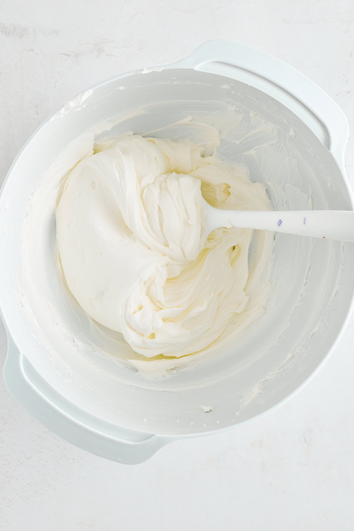 Cheesecake filling in a mixing bowl. 