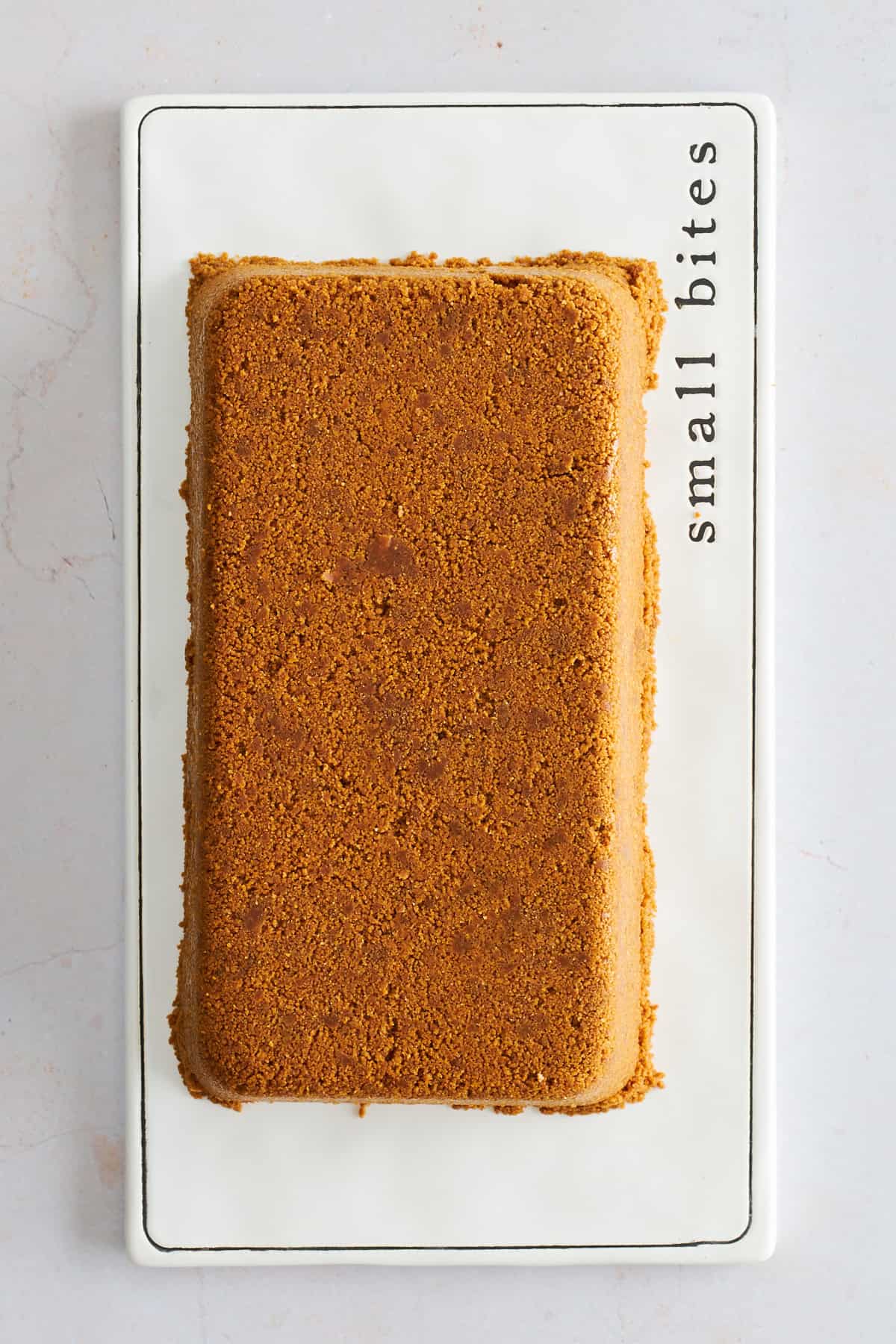 Baked upside down cheeesecake invertred onto a plate. 