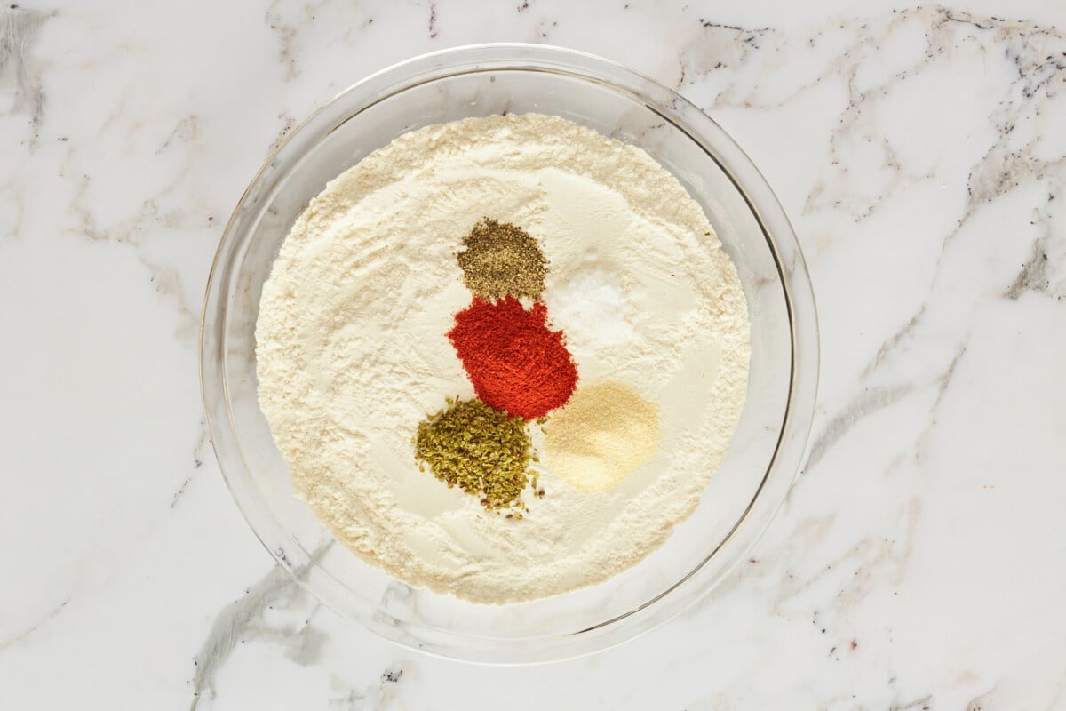 A bowl of flour and seasonings.
