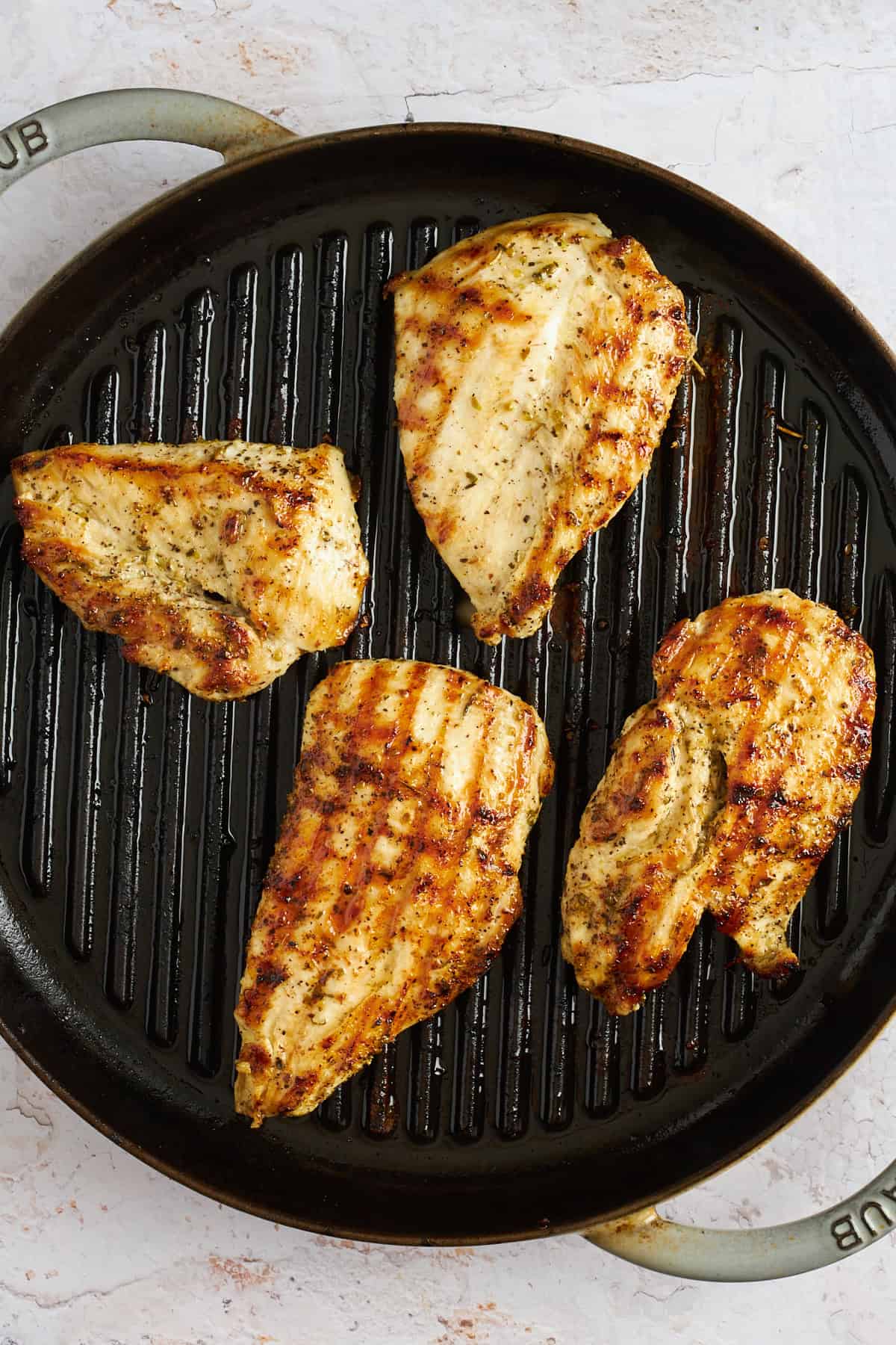 Chicken breasts on a grill pan.
