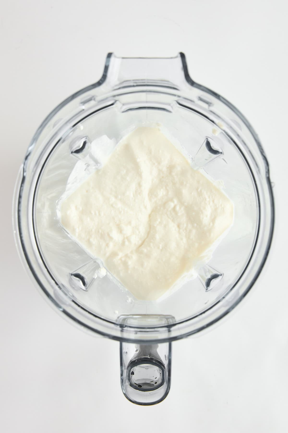 Blended cottage cheese in a blender.