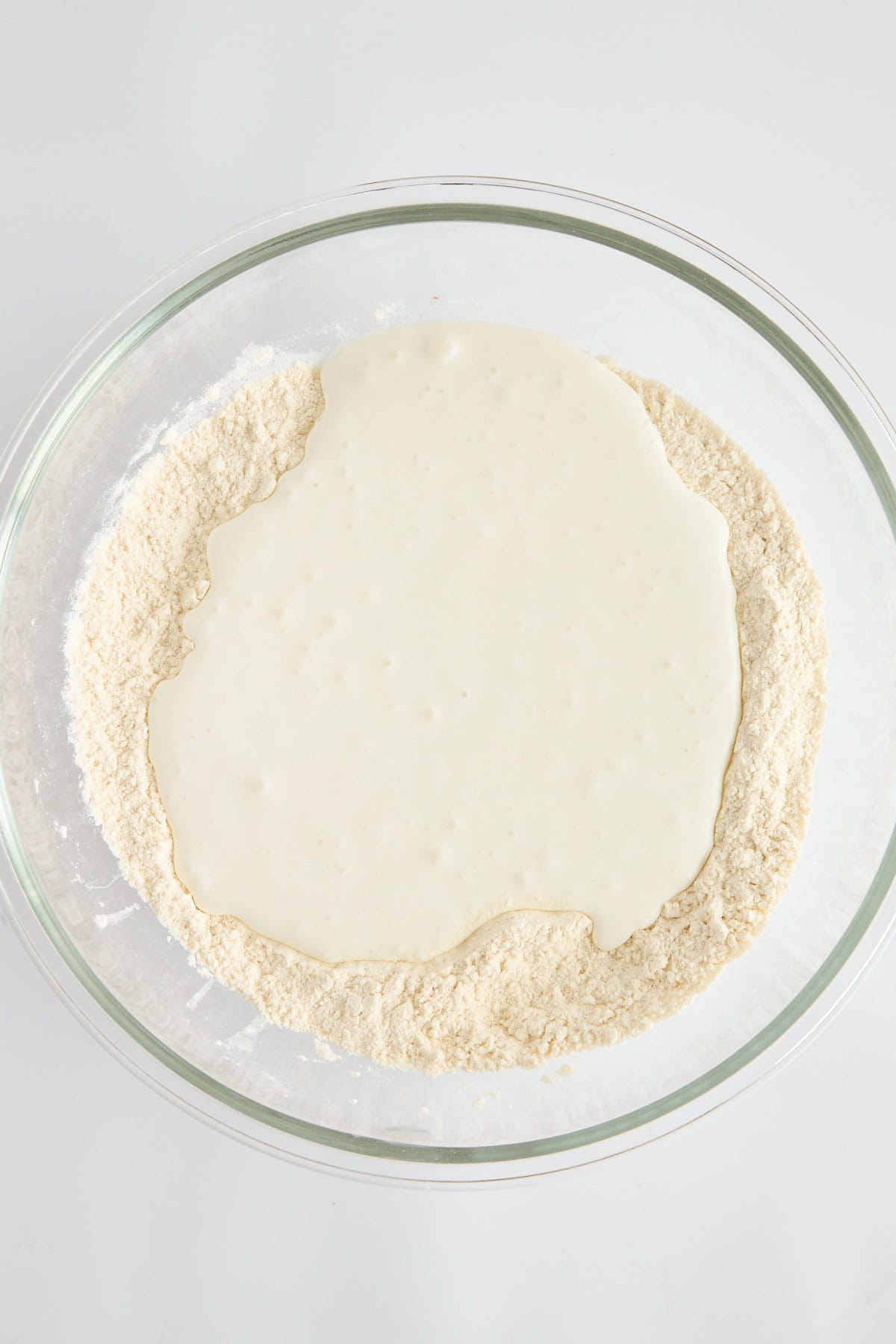 Flour and cottage cheese in a bowl.
