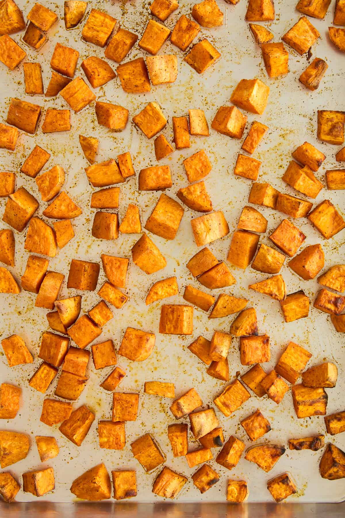 Roasted sweet potatoes on a sheet pan. 