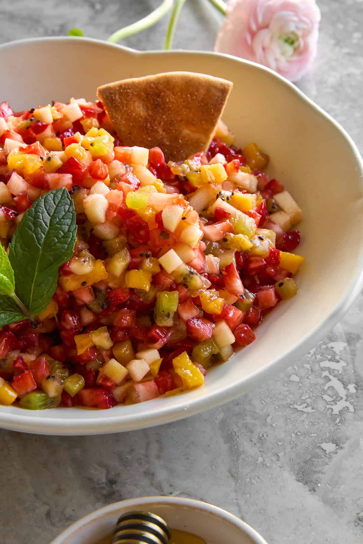 A bowl of fresh fruit salsa.