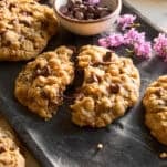 A platter of copycat Crumbl mom's cookies with one split in half.